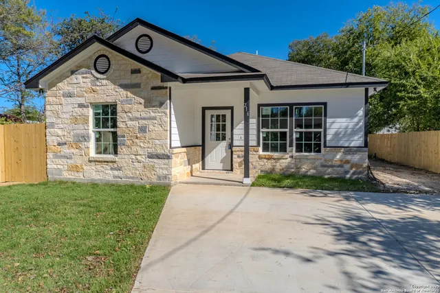 front view of a house with a yard