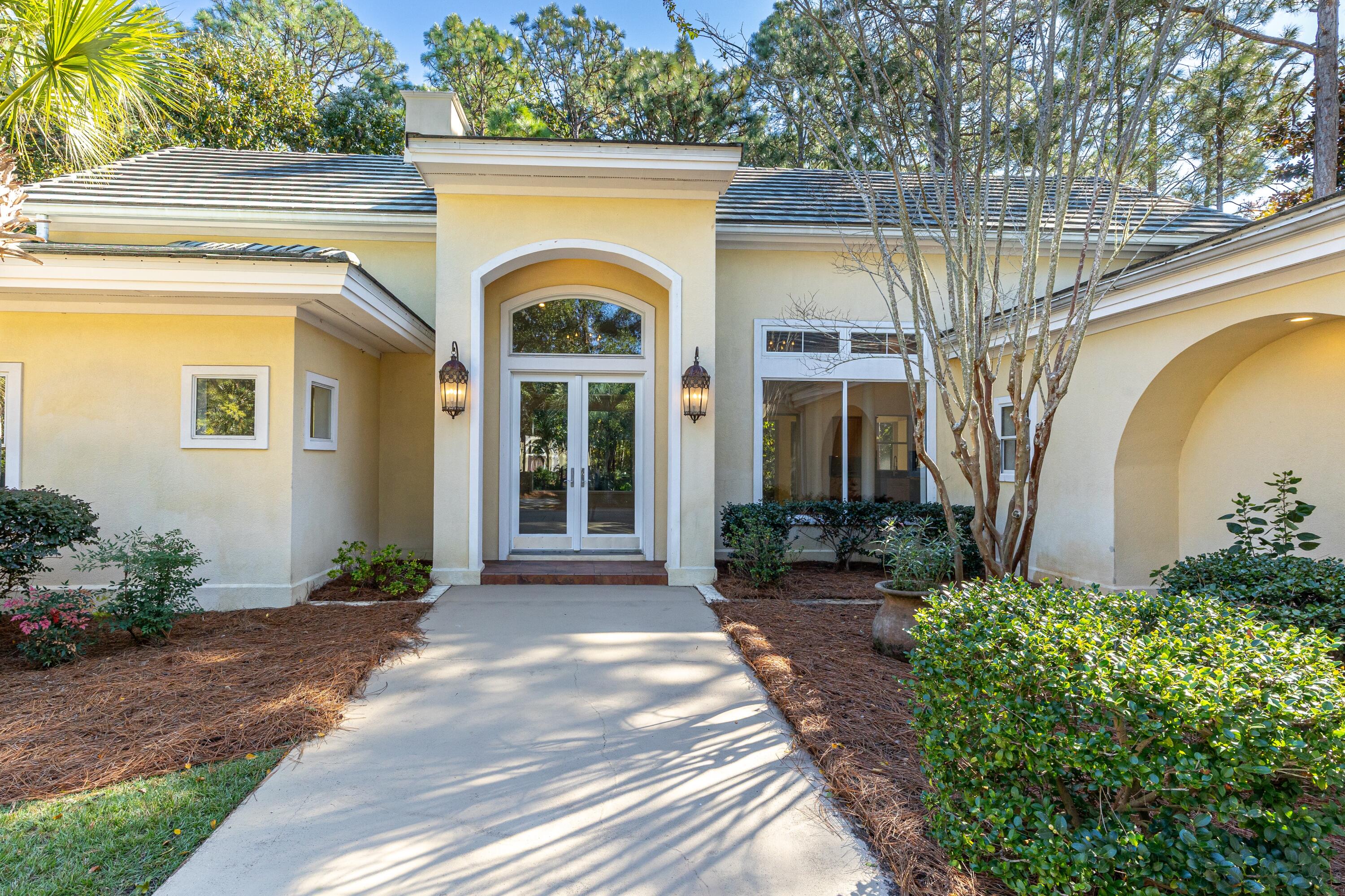 2928 Pine Valley Road Miramar Beach, FL 32550 - Photo 37 of 76 a front view of a house with garden