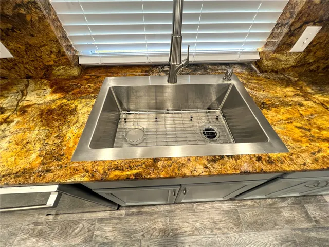 a view of a kitchen counter top of a stove