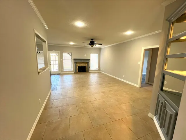a view of a kitchen with a sink and a refrigerator