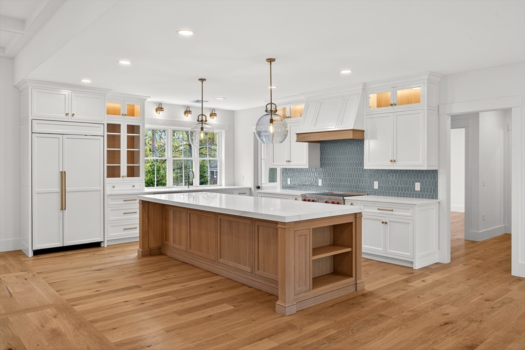 132 Great Western Road Harwich, MA 02645 - Photo 2 of 42 a kitchen with kitchen island granite countertop a stove and a sink