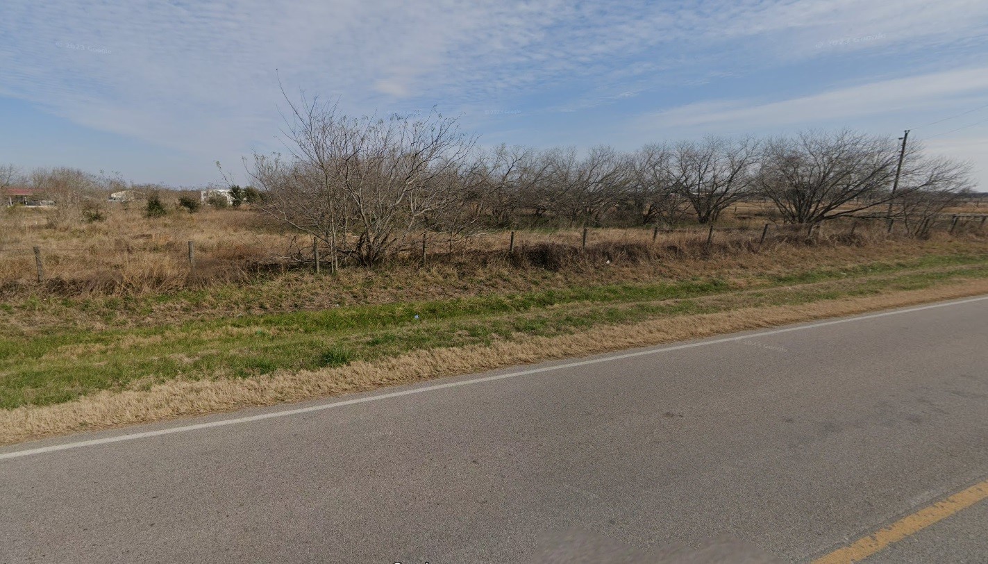8148 Buller Road Pattison, TX 77423 - Photo 5 of 6 a view of a field with trees in background