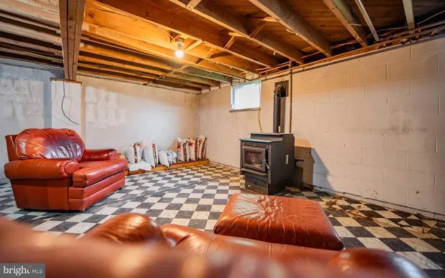 a living room with blue lights with furniture