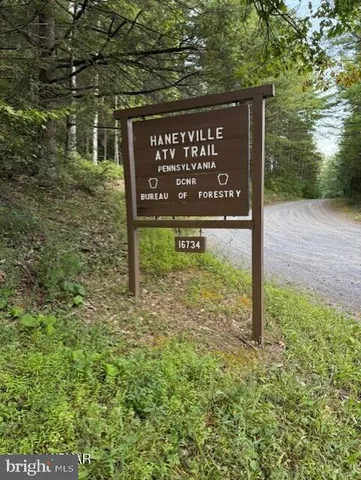 a sign broad on the side of the road