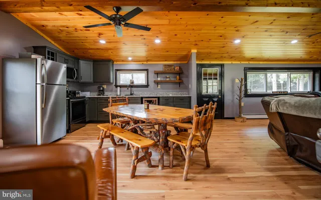 a dining space with furniture and window