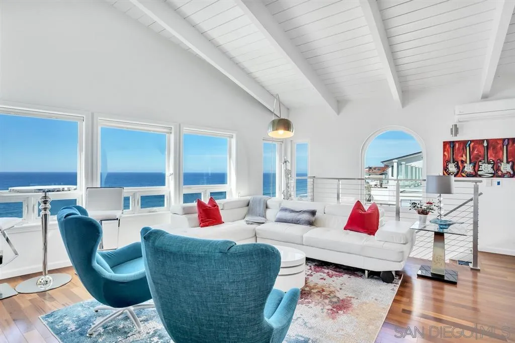 742 Neptune Avenue Encinitas, CA 92024 - Photo 1 of 25 a living room with furniture and a wooden floor