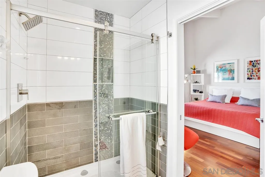 742 Neptune Avenue Encinitas, CA 92024 - Photo 14 of 25 a bathroom with a bathtub and shower