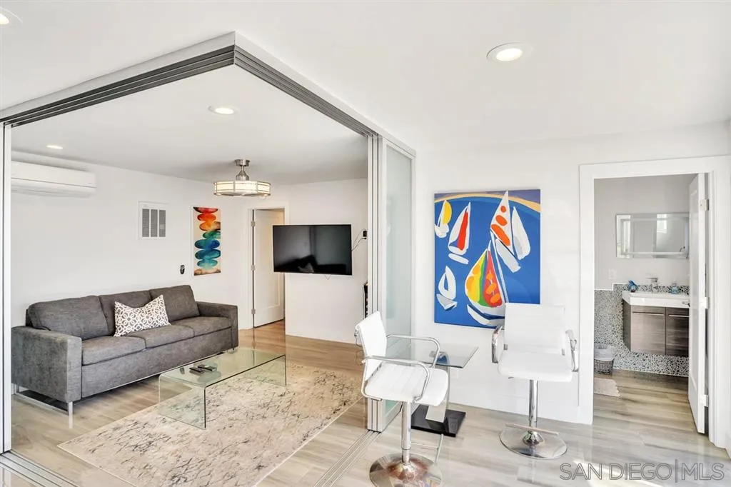 742 Neptune Avenue Encinitas, CA 92024 - Photo 15 of 25 a living room with furniture and kitchen view
