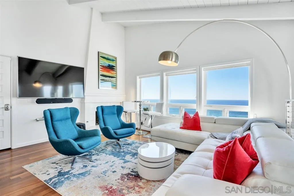 742 Neptune Avenue Encinitas, CA 92024 - Photo 9 of 25 a living room with furniture and a flat screen tv