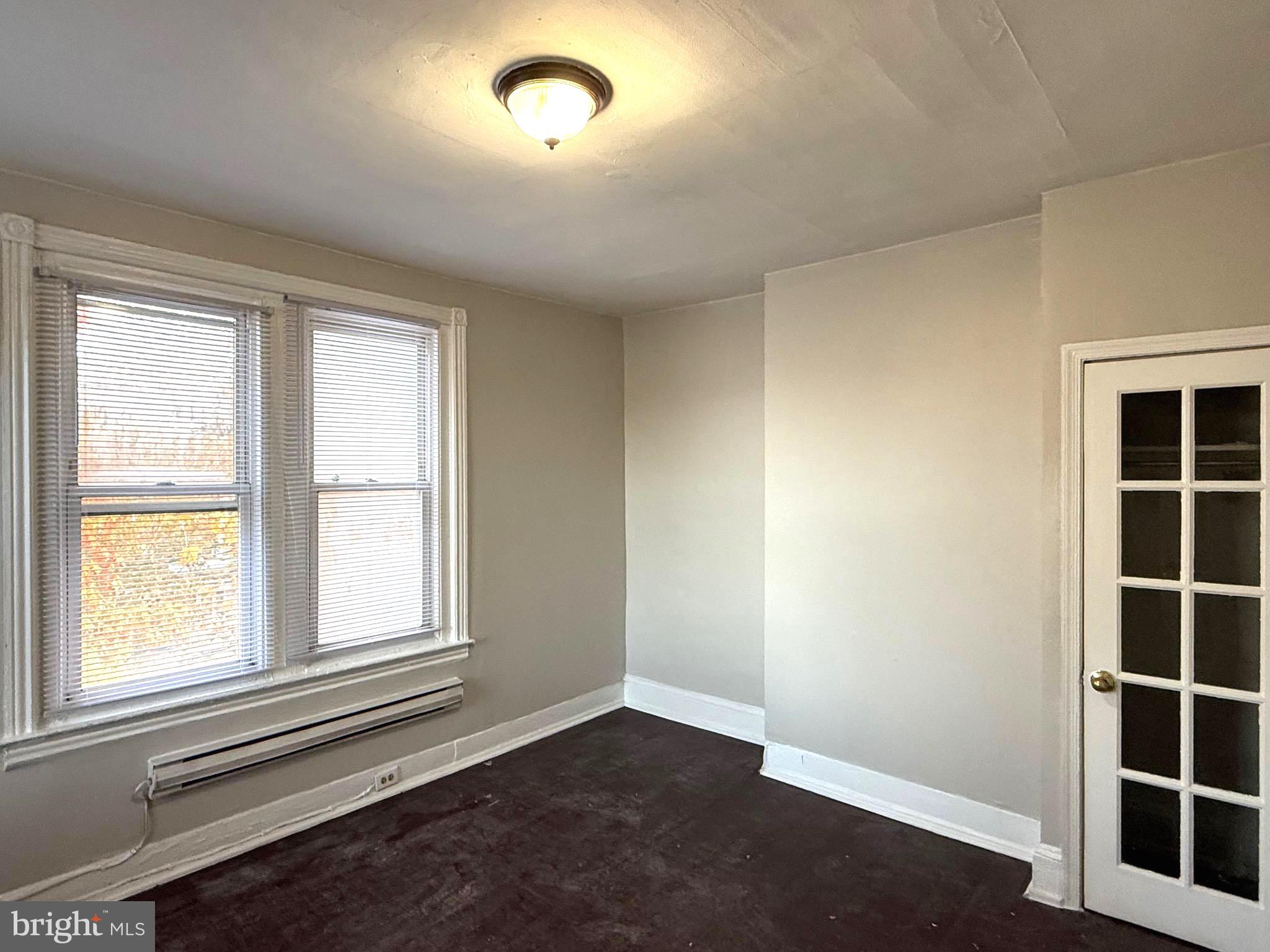 5748 Chestnut Street, Unit C Philadelphia, PA 19139 - Photo 5 of 7 an empty room with windows