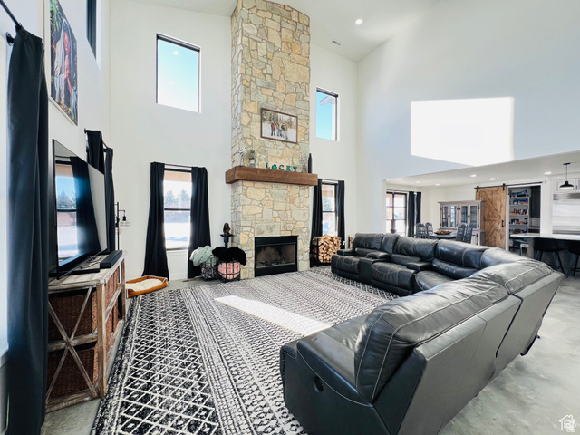 100 Whit Lane Georgetown, ID 83239 - Photo 16 of 76 Living area with a high ceiling, a fireplace, and recessed lighting
