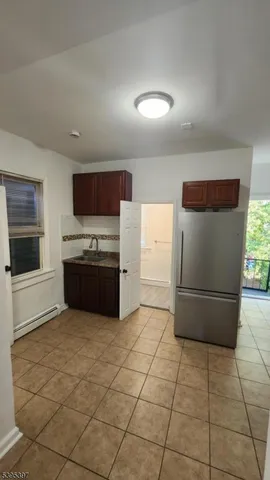 a kitchen with a cabinets and a stove top oven