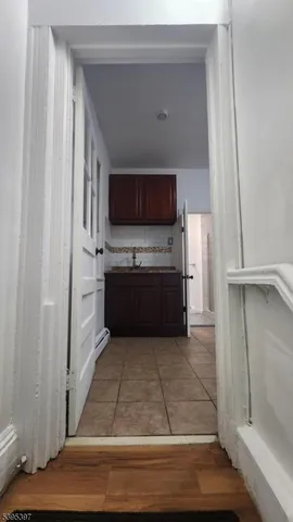 a view of kitchen with microwave and cabinets