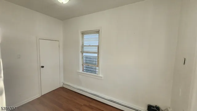 a bathroom with a toilet sink and a mirror