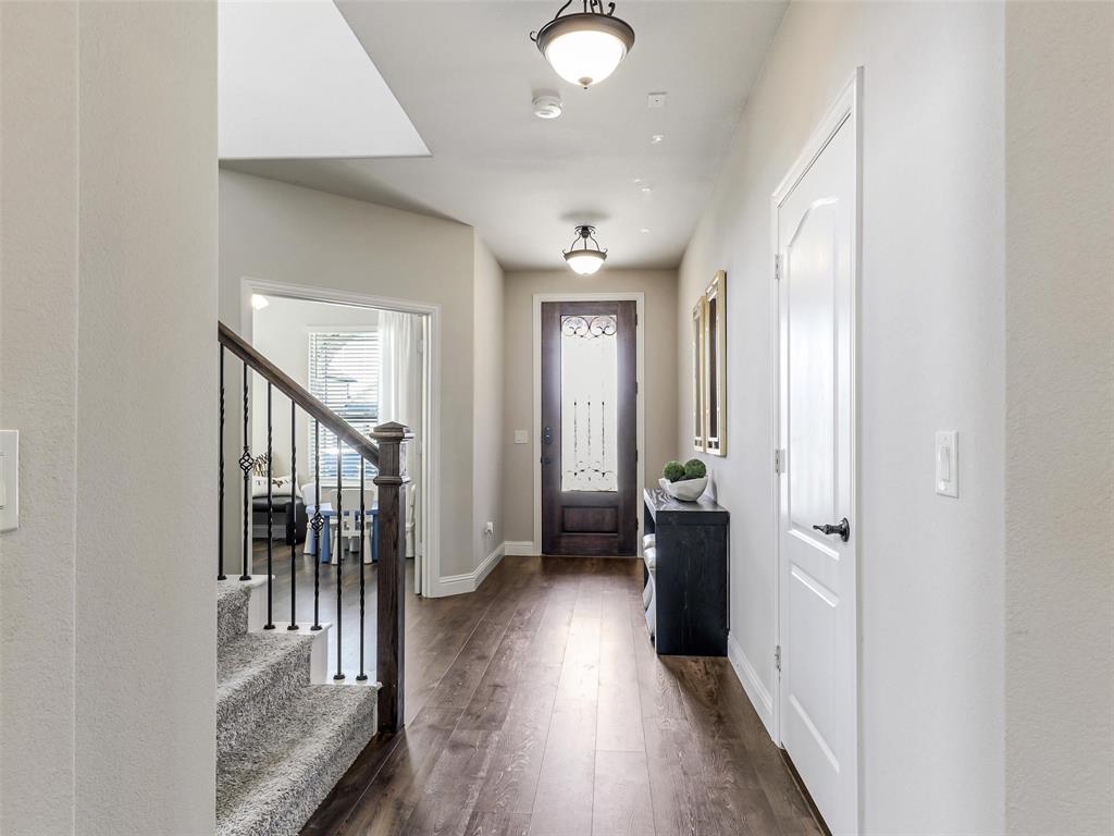 1216 Tree Shadow Lane Anna, TX 75409 - Photo 2 of 37 a view of a hallway view with wooden floor and staircase