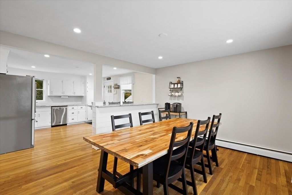 185 Temi Road Raynham, MA 02767 - Photo 18 of 33 a view of a dining room with furniture and wooden floor