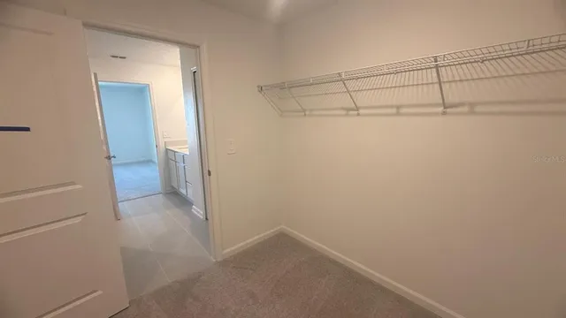 a bathroom with a granite countertop toilet and a shower