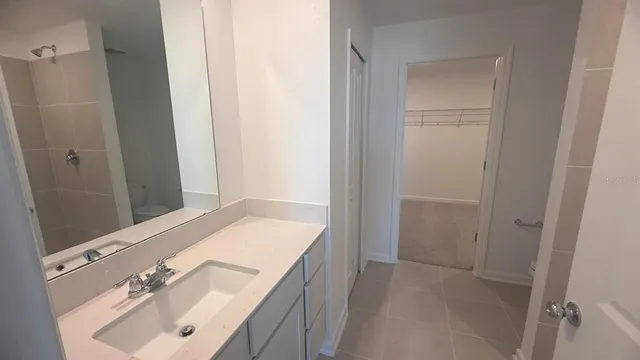 a view of an empty room and a window