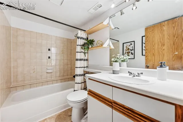 a picture of a bathroom with a shower