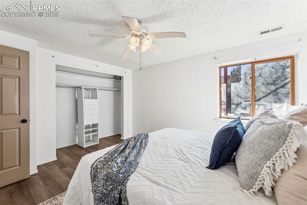 6447 Jonathan Court Colorado Springs, CO 80918 - Photo 10 of 16 a bedroom with a large bed and a window