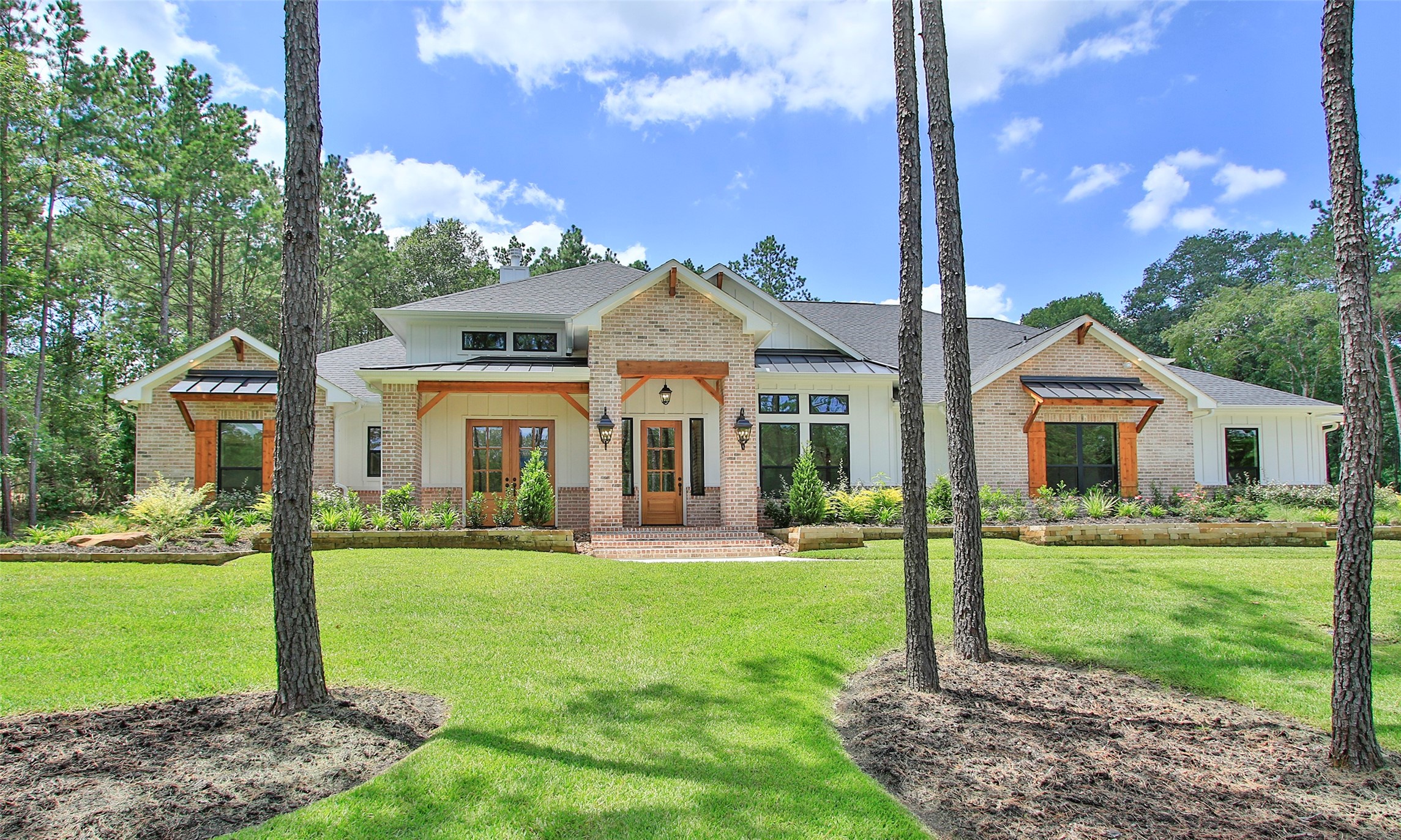 10795 Ruger Road Willis, TX 77378 - Photo 24 of 24 a front view of house with a garden and plants