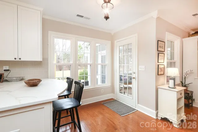 a kitchen with stainless steel appliances a refrigerator sink and cabinets