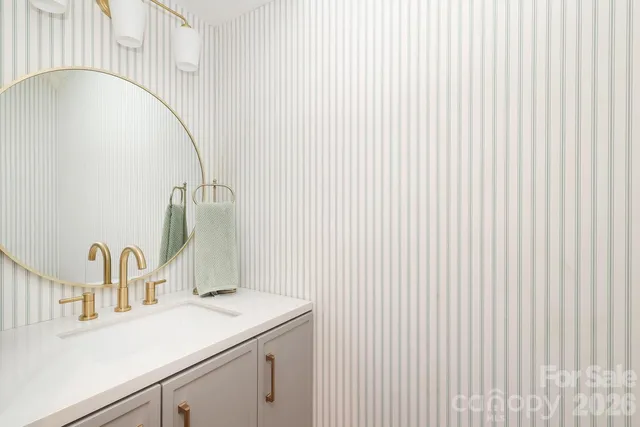 a kitchen with stainless steel appliances a stove a refrigerator and a window