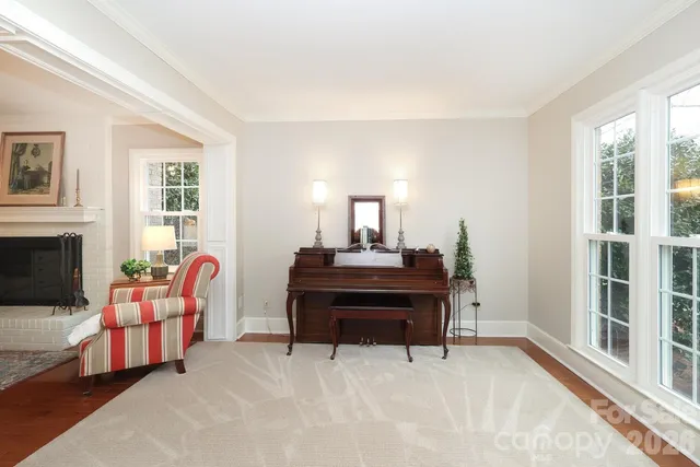 a dining room with furniture and chandelier