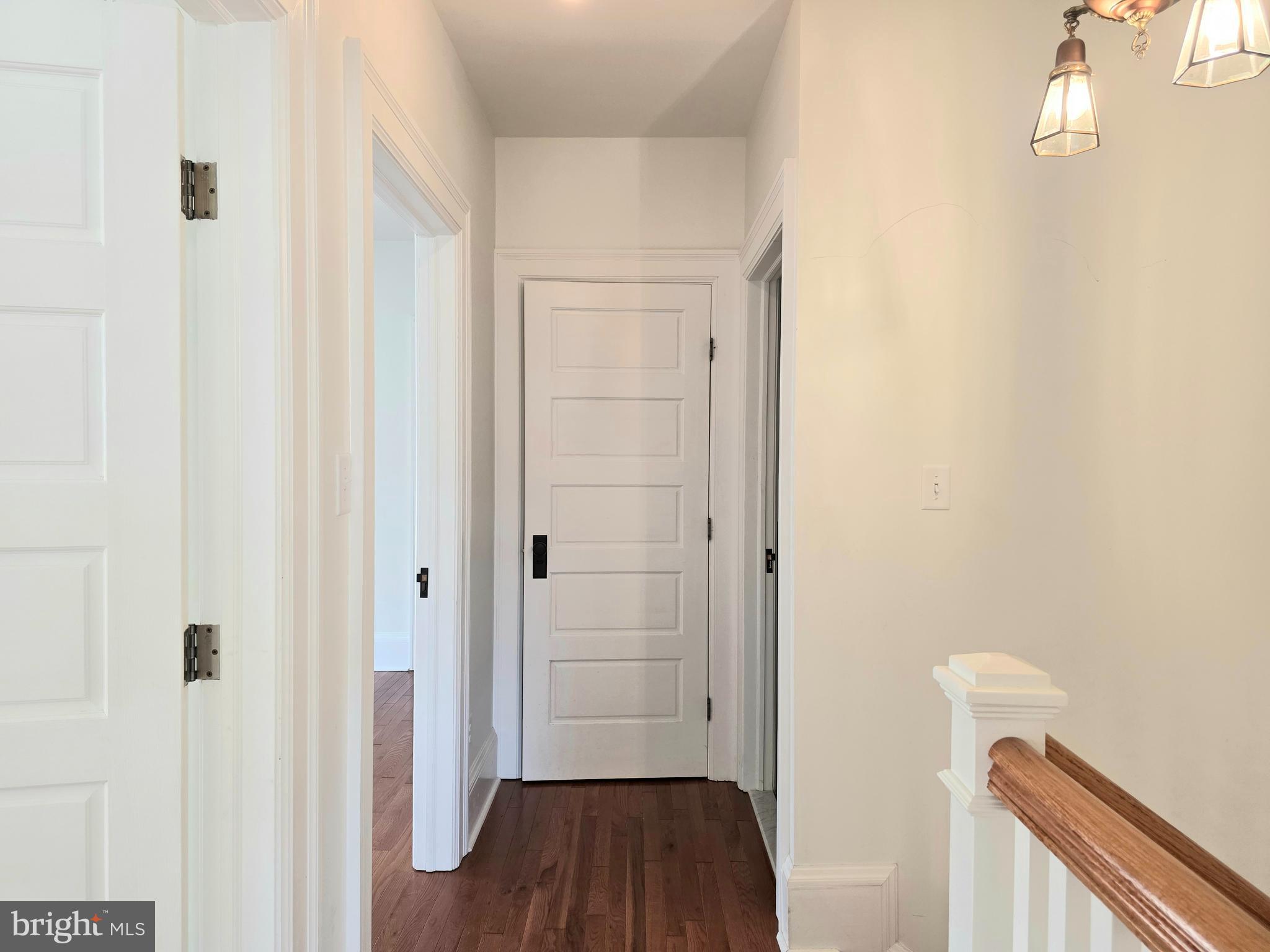 1306 B Officers Row, Unit B Delaware City, DE 19706 - Photo 2 of 10 a view of a hallway with wooden floor