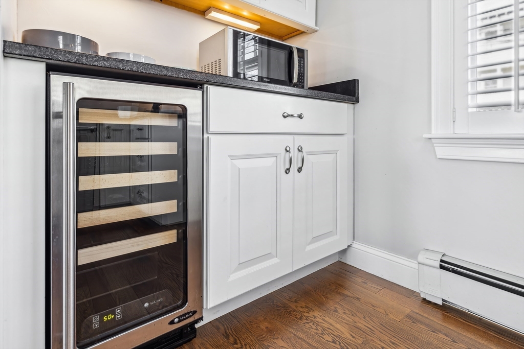 25 Bay Street Hull, MA 02045 - Photo 11 of 27 a view of an empty room with wooden floor and a window
