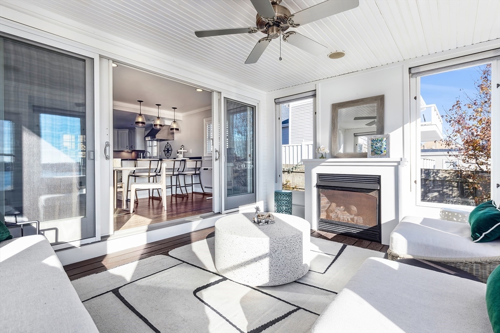 25 Bay Street Hull, MA 02045 - Photo 13 of 27 a living room with furniture and a fireplace