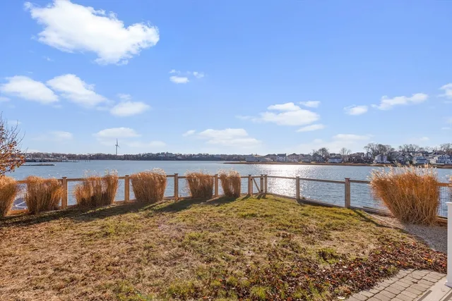 a view of a lake with a big yard