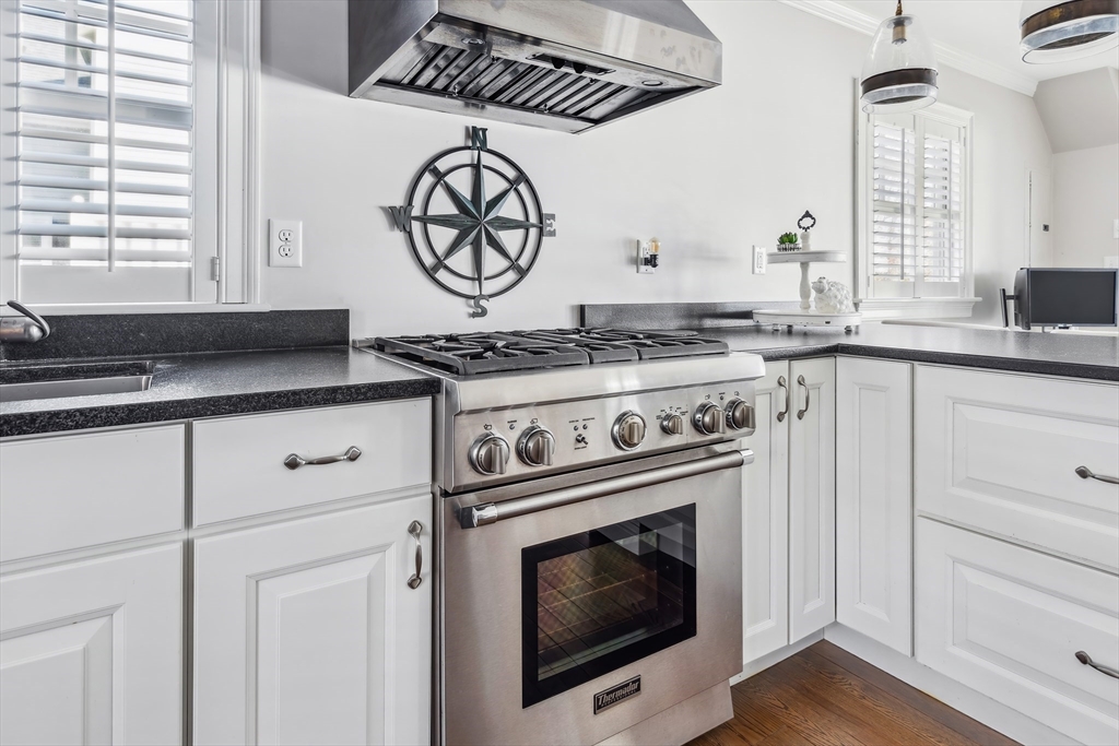 25 Bay Street Hull, MA 02045 - Photo 9 of 27 a stove top oven sitting inside of a kitchen