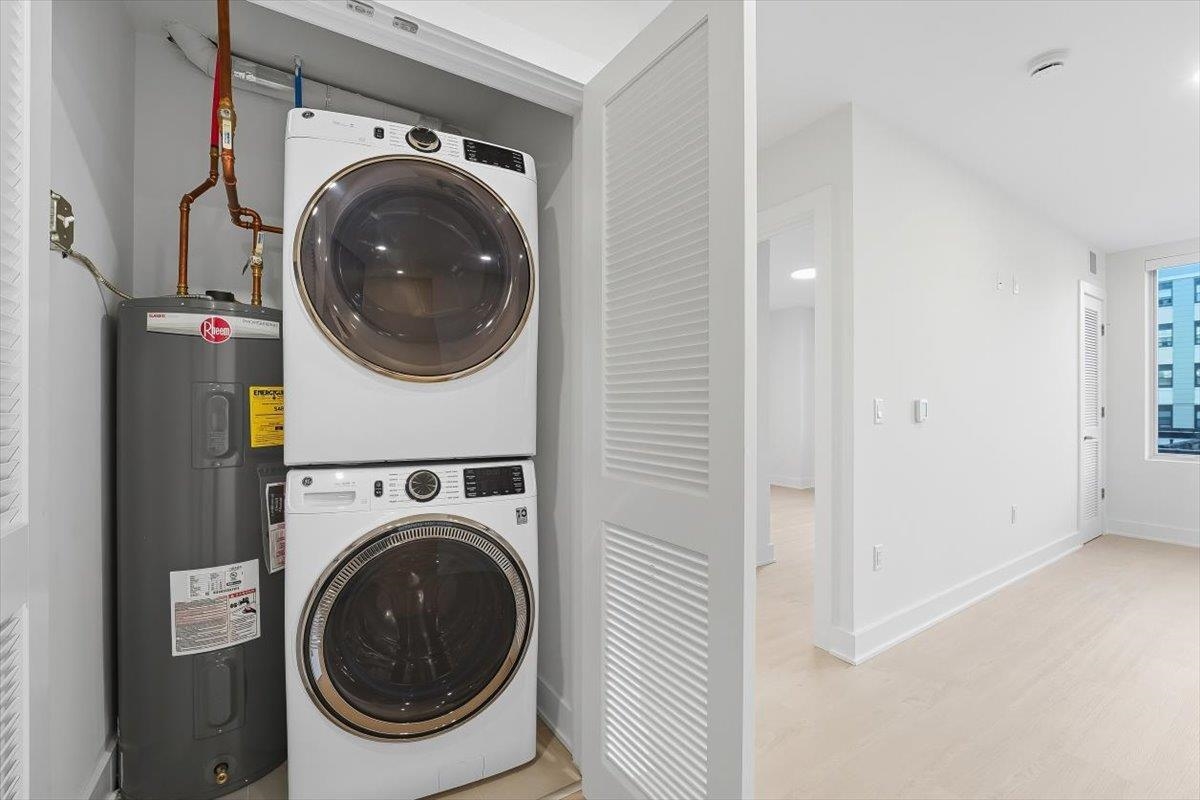 303 Madison Street, Unit 408 Hoboken, NJ 07030 - Photo 12 of 26 a view of a hallway with washer and dryer