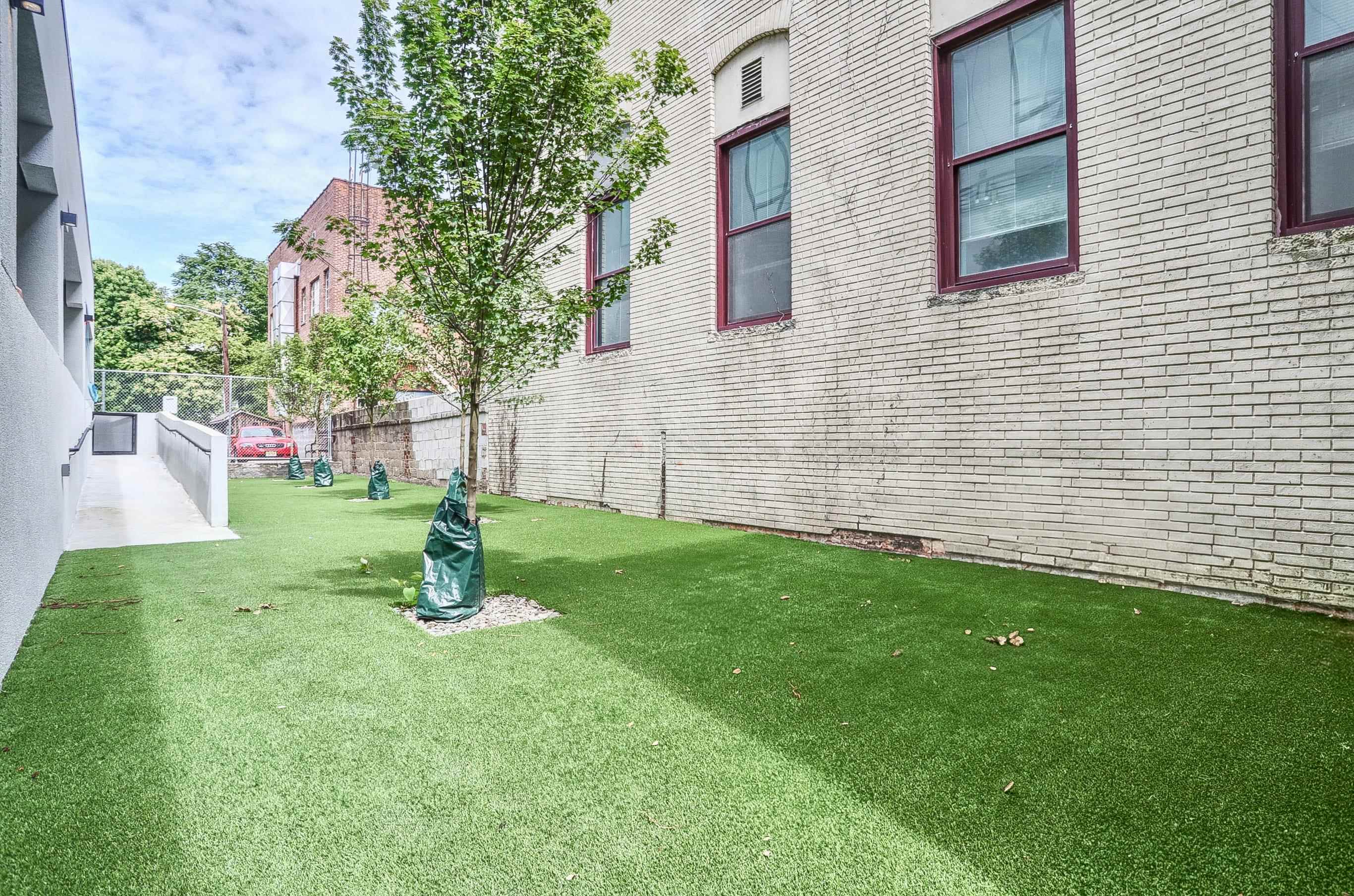 303 Madison Street, Unit 408 Hoboken, NJ 07030 - Photo 16 of 26 a view of a backyard with a garden