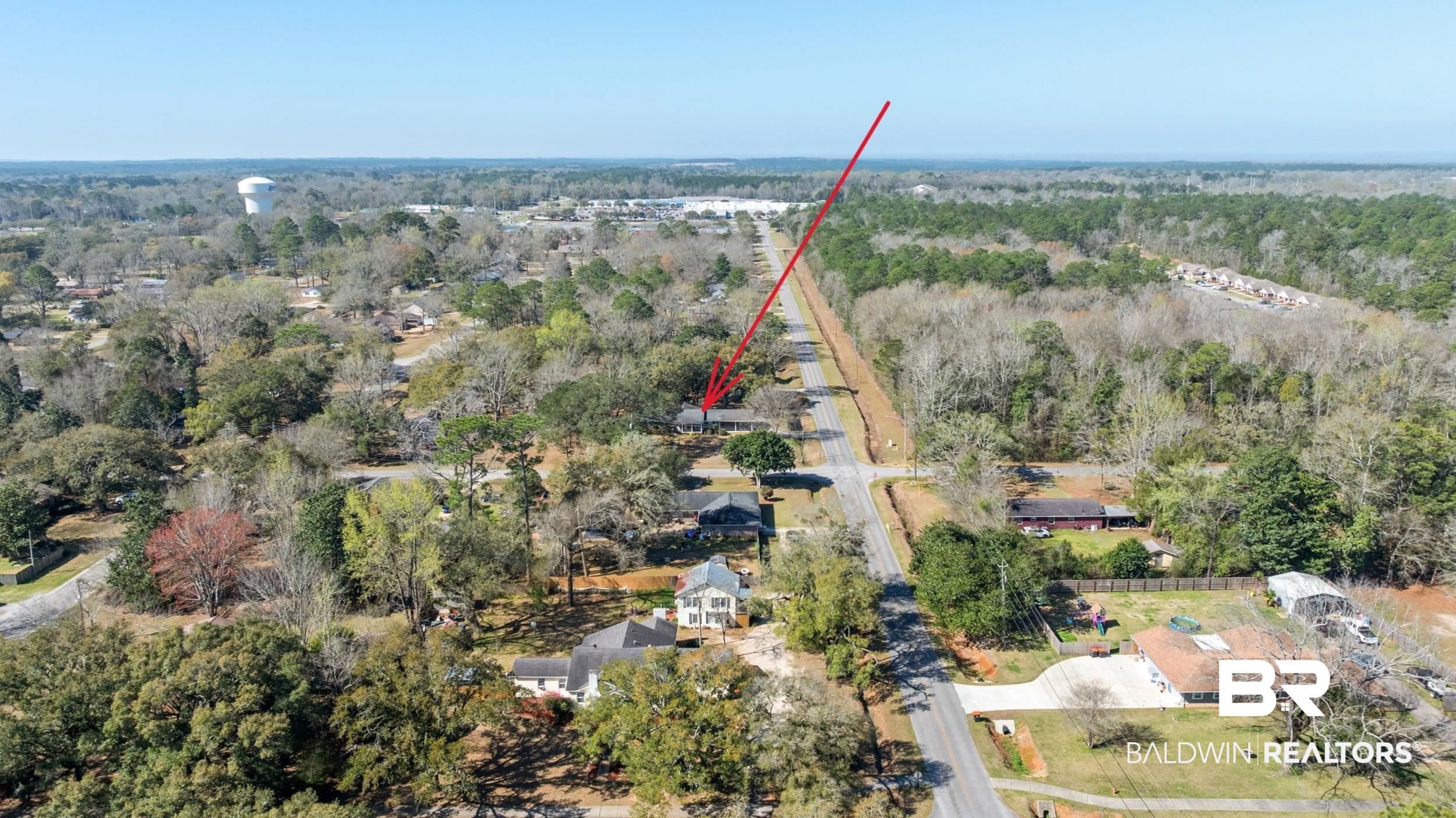 809 Moog Avenue Bay Minette, AL 36507 - Photo 28 of 33 Aerial perspective of suburban area featuring a heavily wooded area