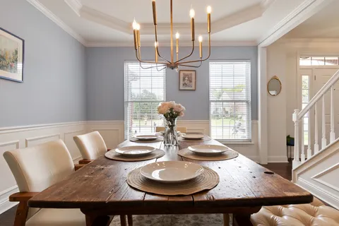 a bedroom with a bed and a lamp on table