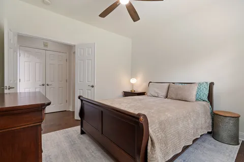 a living room with furniture wooden floor and a flat screen tv