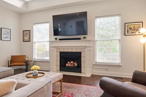 a kitchen with stainless steel appliances a stove a sink refrigerator and a window