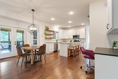 a dining room with furniture window wooden floor