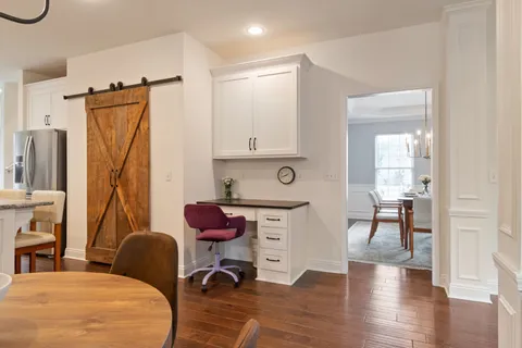 a spacious bedroom with bed and a flat screen tv