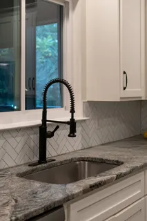 a view of an empty room window and wooden floor