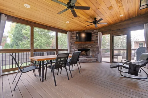 an aerial view of residential houses with outdoor space and swimming pool