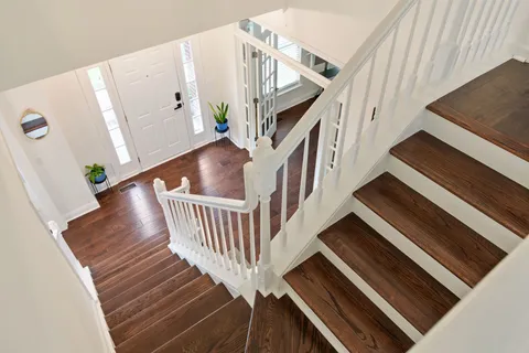 an aerial view of residential house with outdoor space and swimming pool