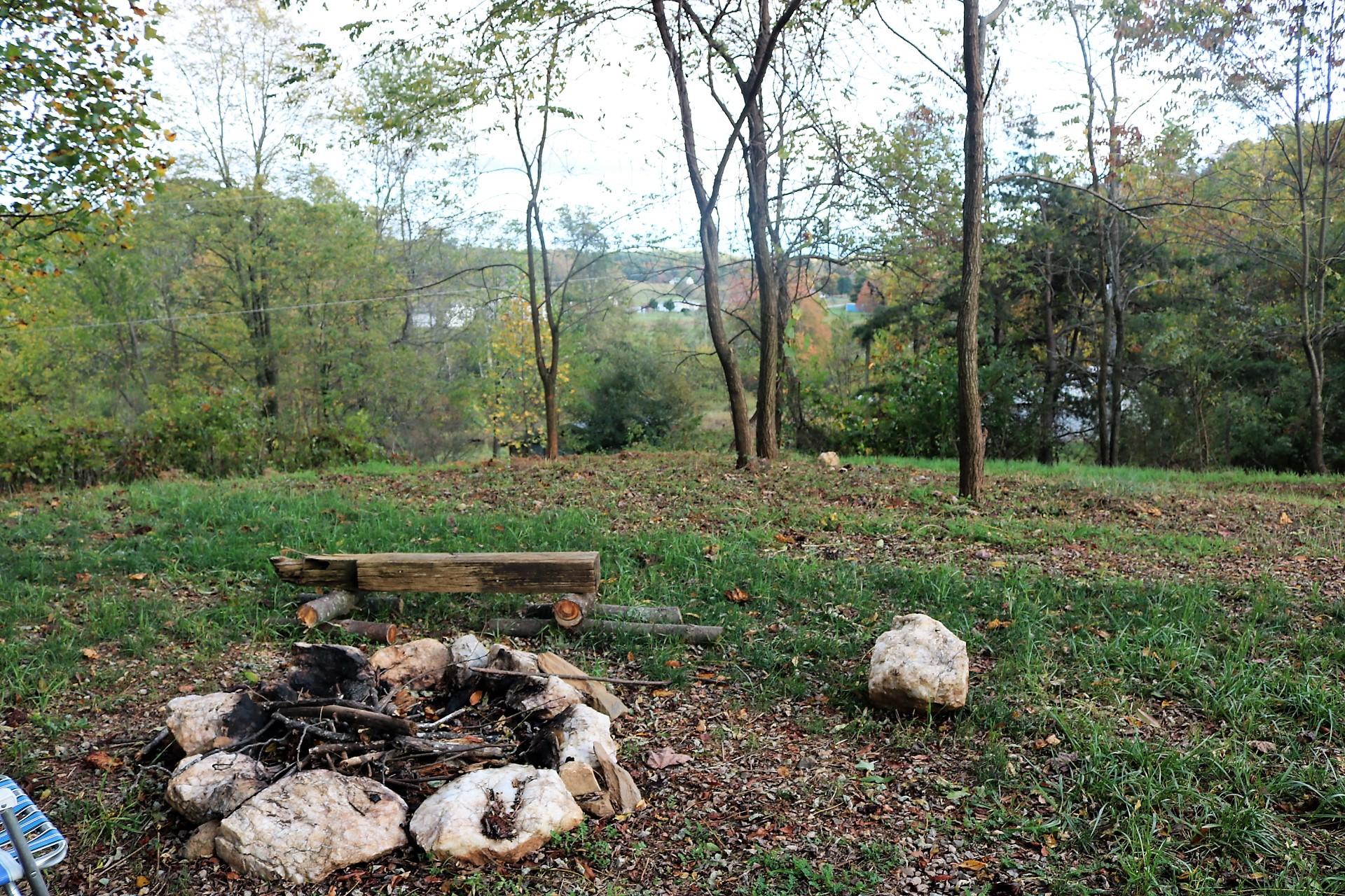 174 Spring Dale Road Southwest Floyd, VA 24091 - Photo 15 of 37 a wooden bench sitting in the middle of a forest