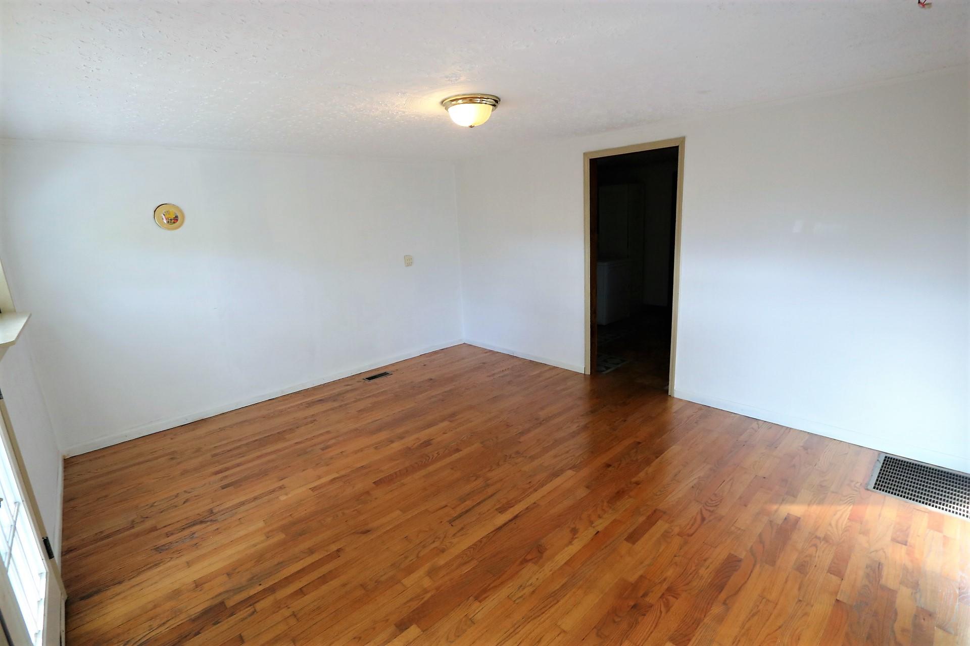 174 Spring Dale Road Southwest Floyd, VA 24091 - Photo 21 of 37 a view of empty room with wooden floor