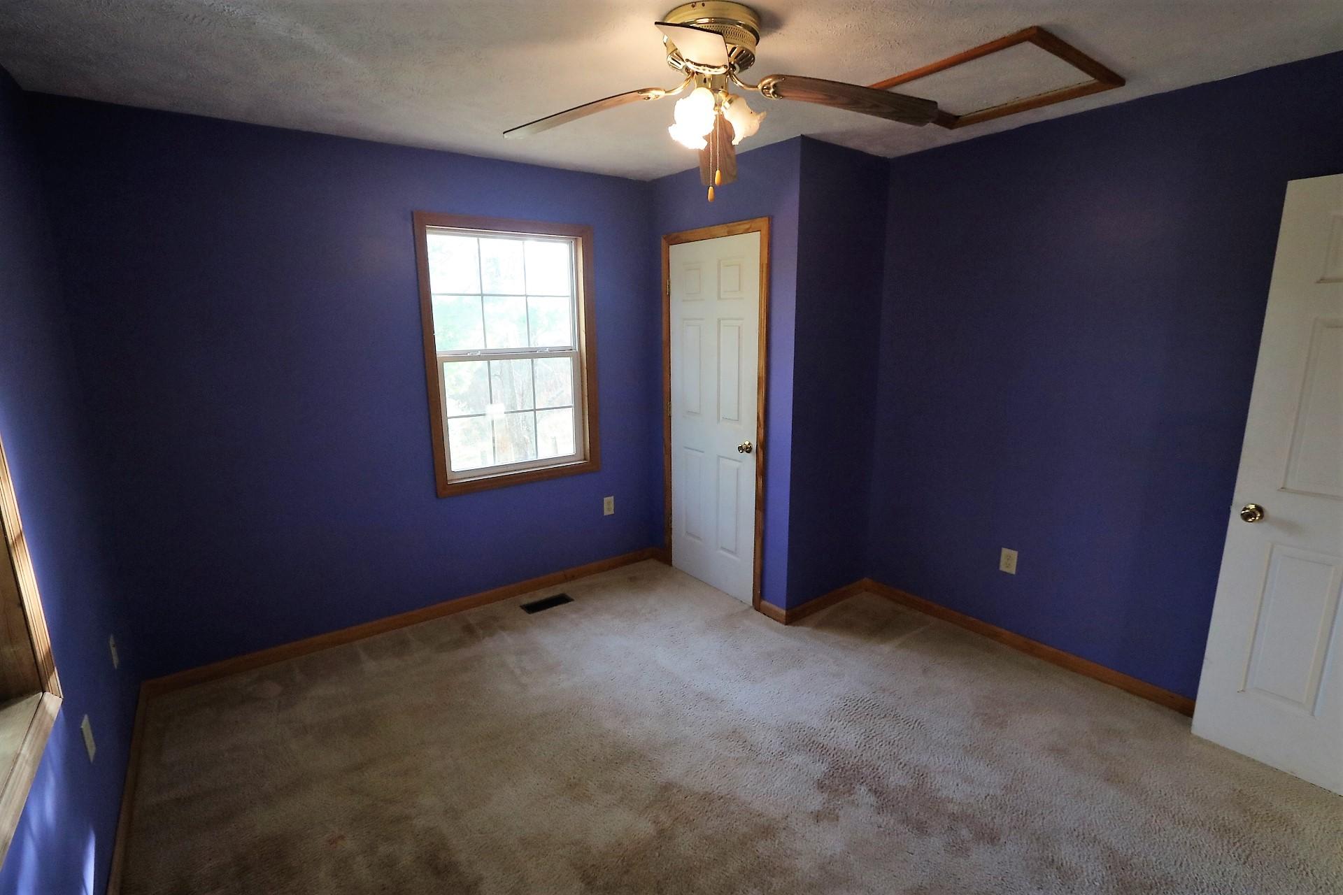 174 Spring Dale Road Southwest Floyd, VA 24091 - Photo 24 of 37 an empty room with windows and fan