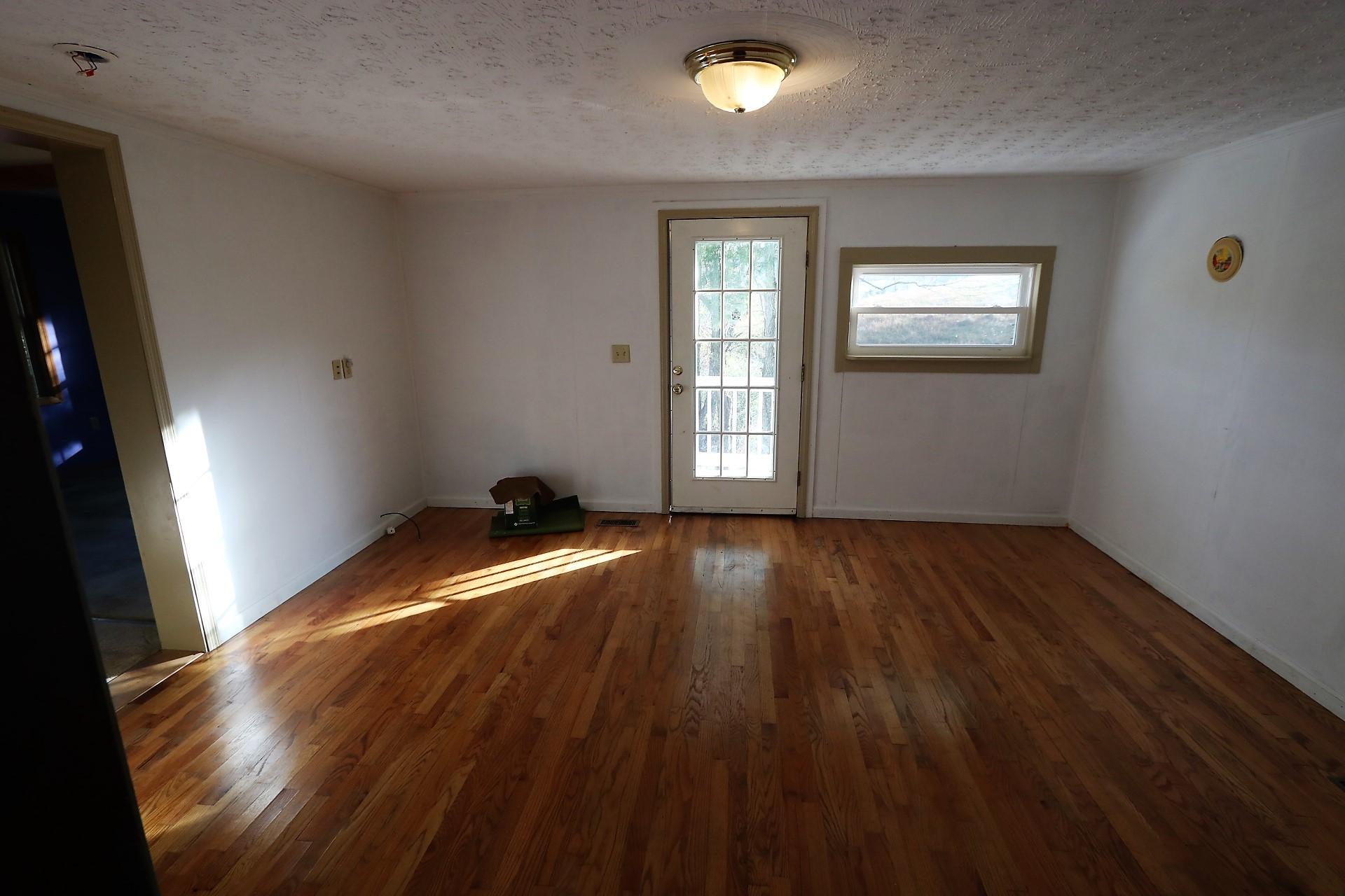 174 Spring Dale Road Southwest Floyd, VA 24091 - Photo 28 of 37 a view of empty room with wooden floor and fan