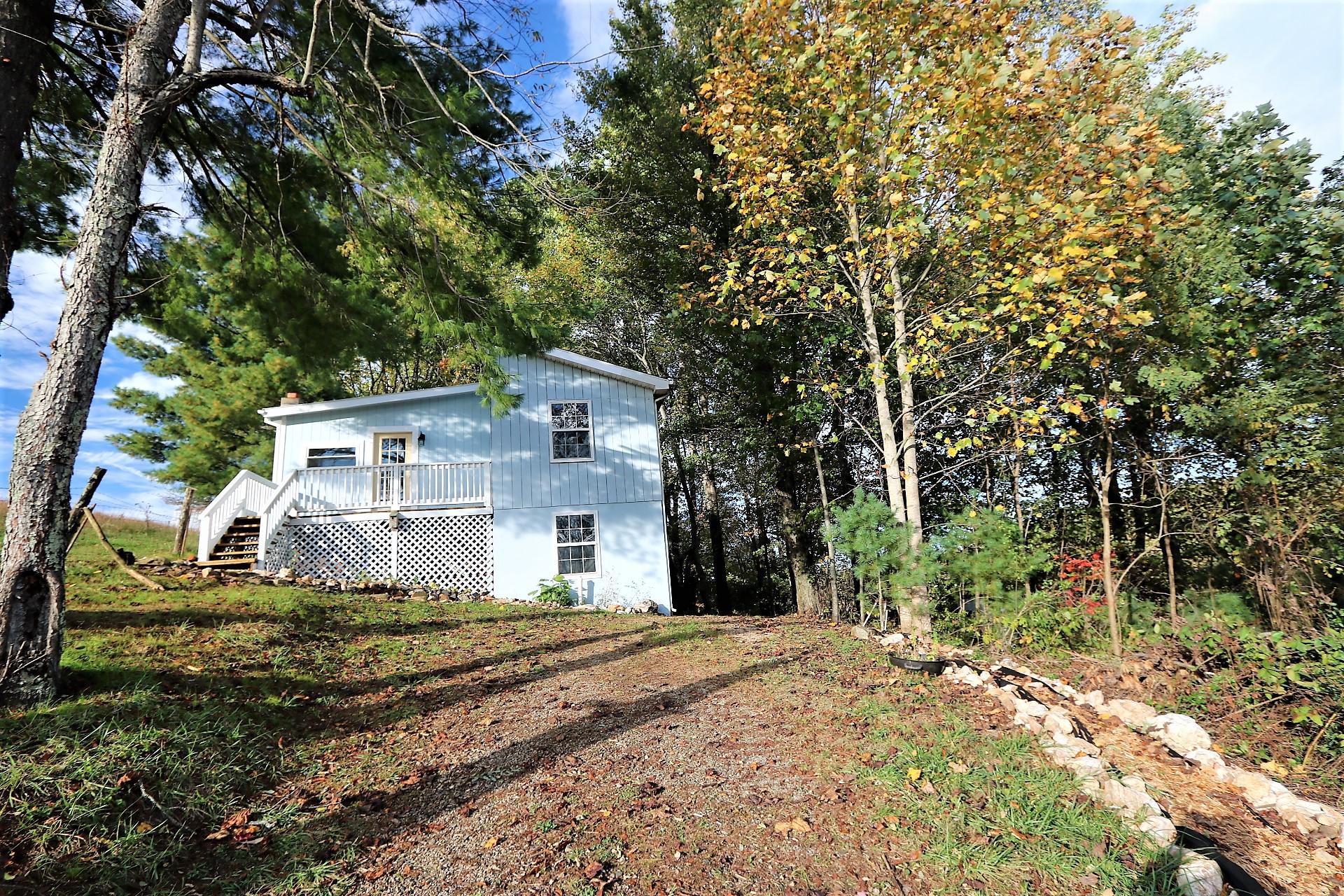 174 Spring Dale Road Southwest Floyd, VA 24091 - Photo 4 of 37 a front view of a house with a yard