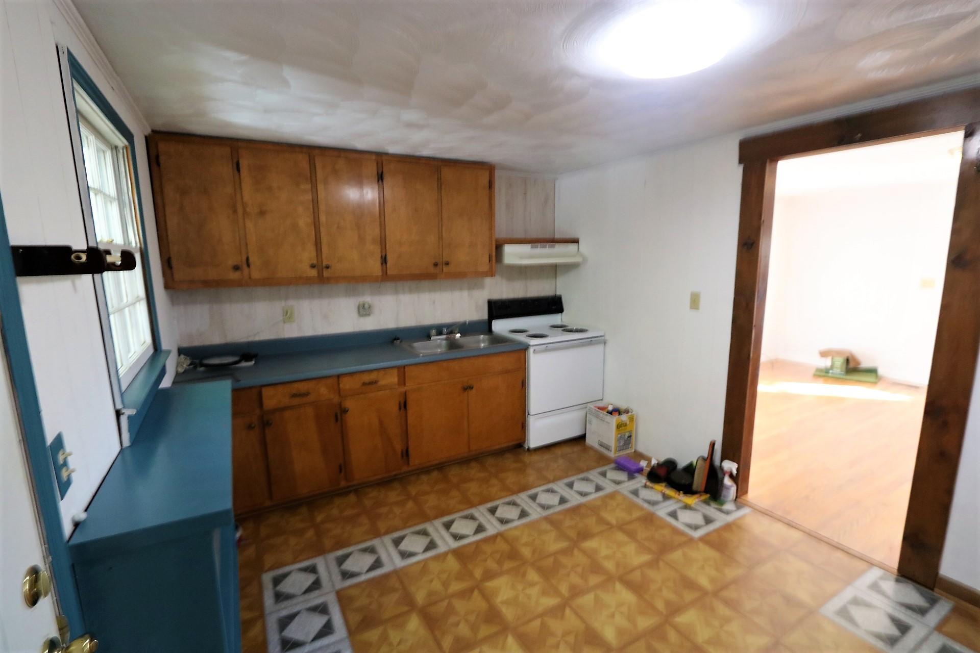 174 Spring Dale Road Southwest Floyd, VA 24091 - Photo 31 of 37 a view of a kitchen with wooden floor and a sink